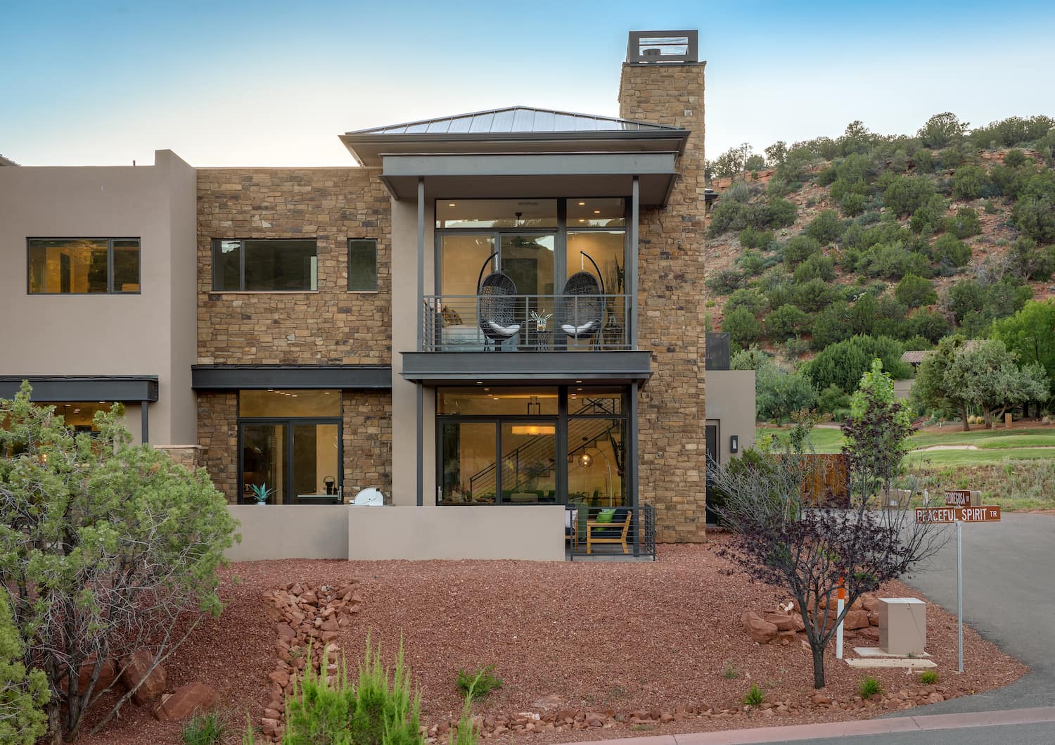 Multiple outdoor living spaces with spectacular views of Sedona.